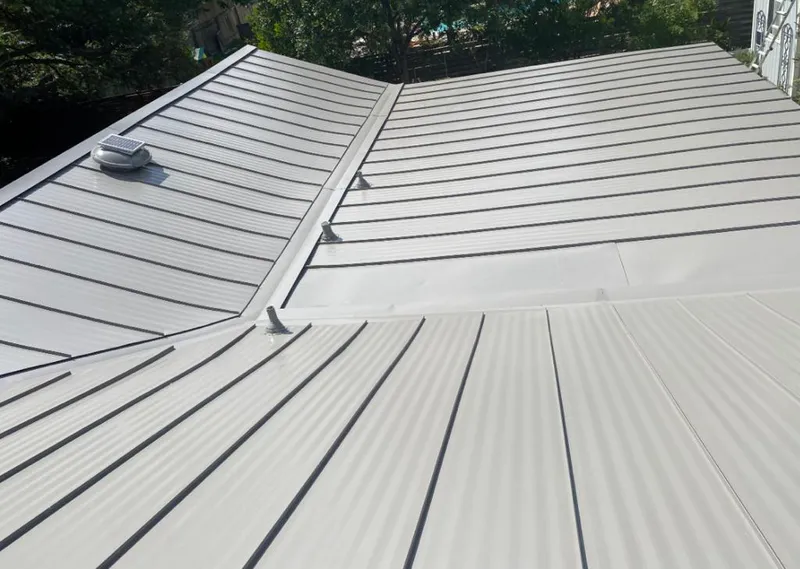Solar attic fan installed on a metal roof for Roof Ventilation in Hollywood